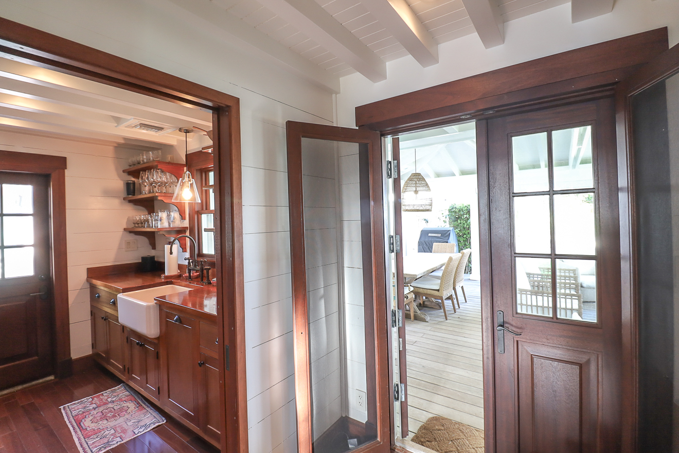 Cottage One entry hallway with view through to the kitchen and French doors to the veranda